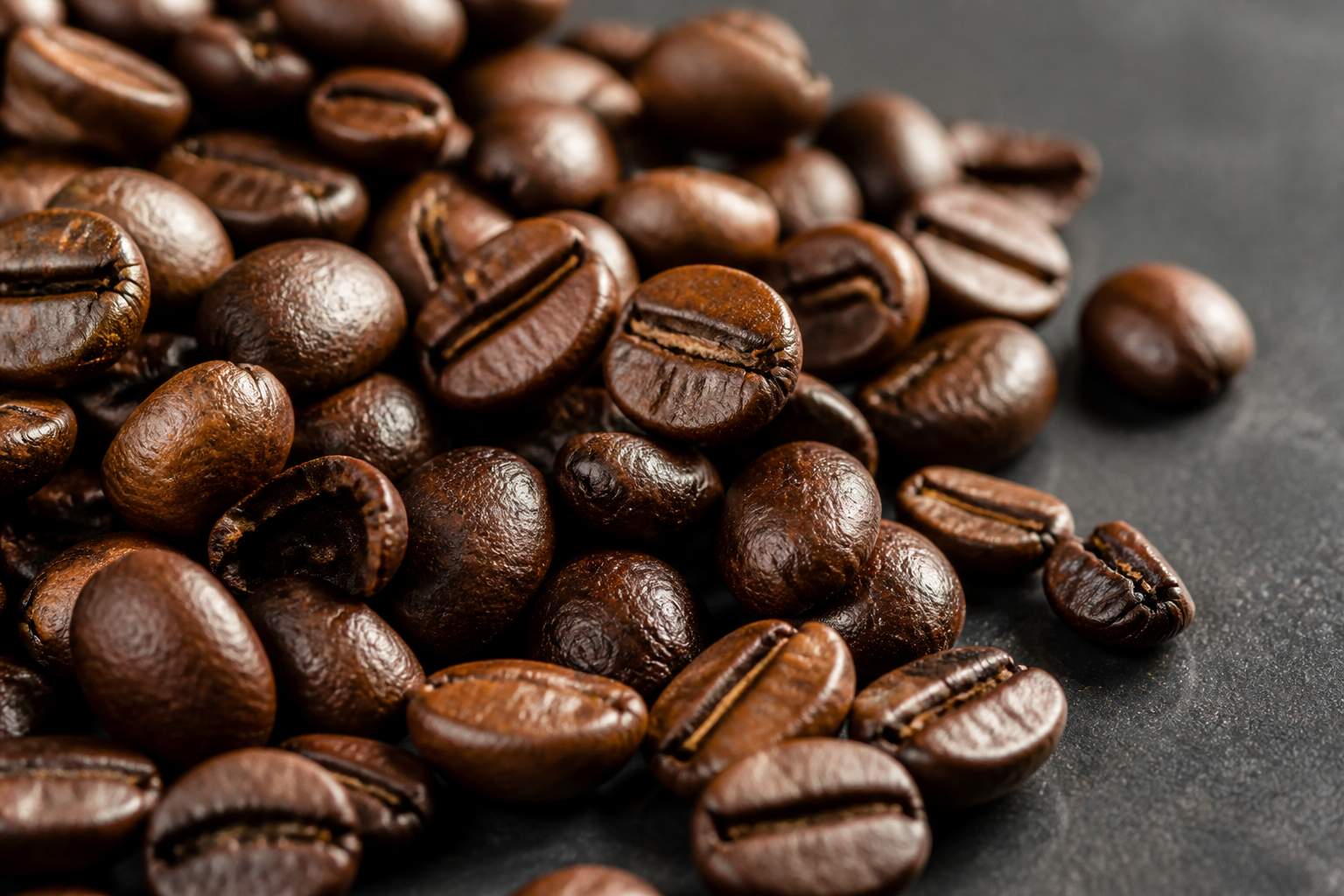 Macro close-up of dark roasted arabica beans